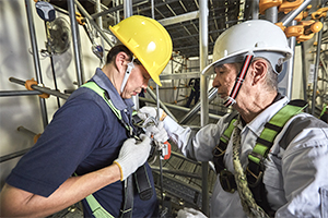 Construction workers following preventative safety procedures