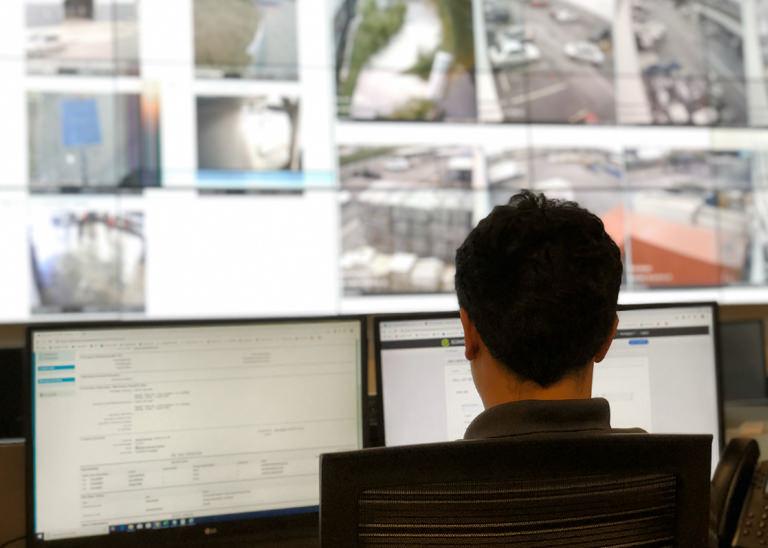 Security guard doing remote video monitoring