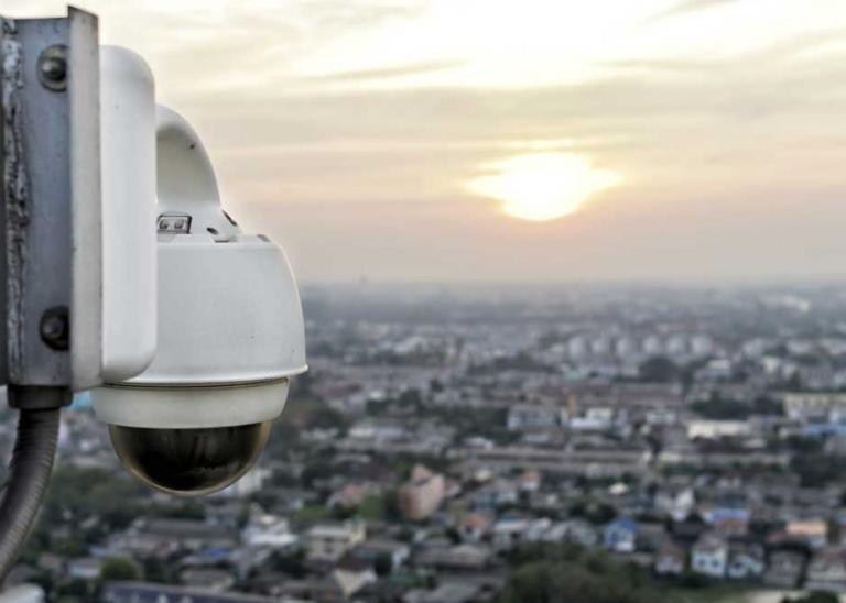 Surveillance camera monitoring a neighborhood